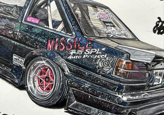 Close-up drawing of a black glitter-finish drift car with red star wheels and Missile Auto Project lettering